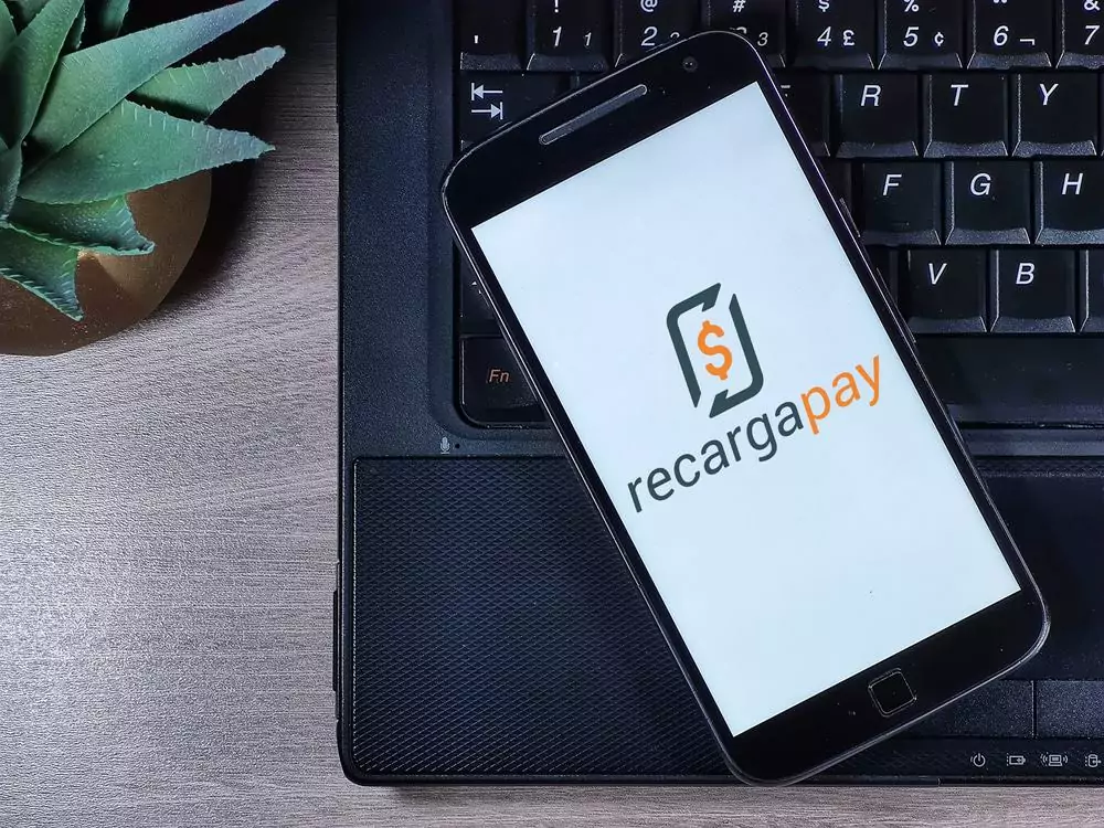 6 apps de cashback para comprar e receber dinheiro de volta Guia Região dos Lagos 12 Logotipo do RecargaPay