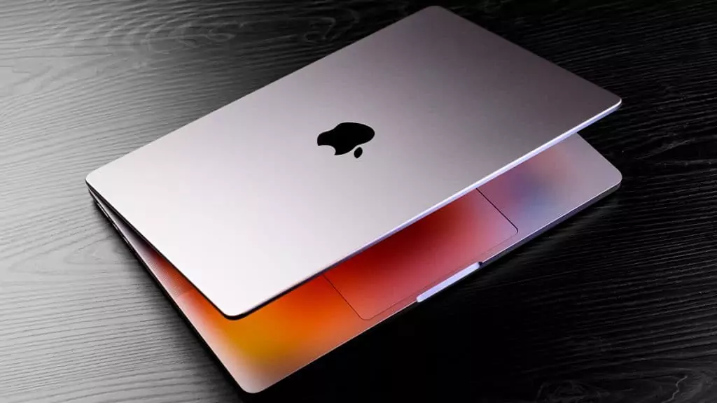 Como ajustar o MacBook para NÃO ligar ao ser aberto Guia Região dos Lagos 14 MacBook aberto em mesa de trabalho